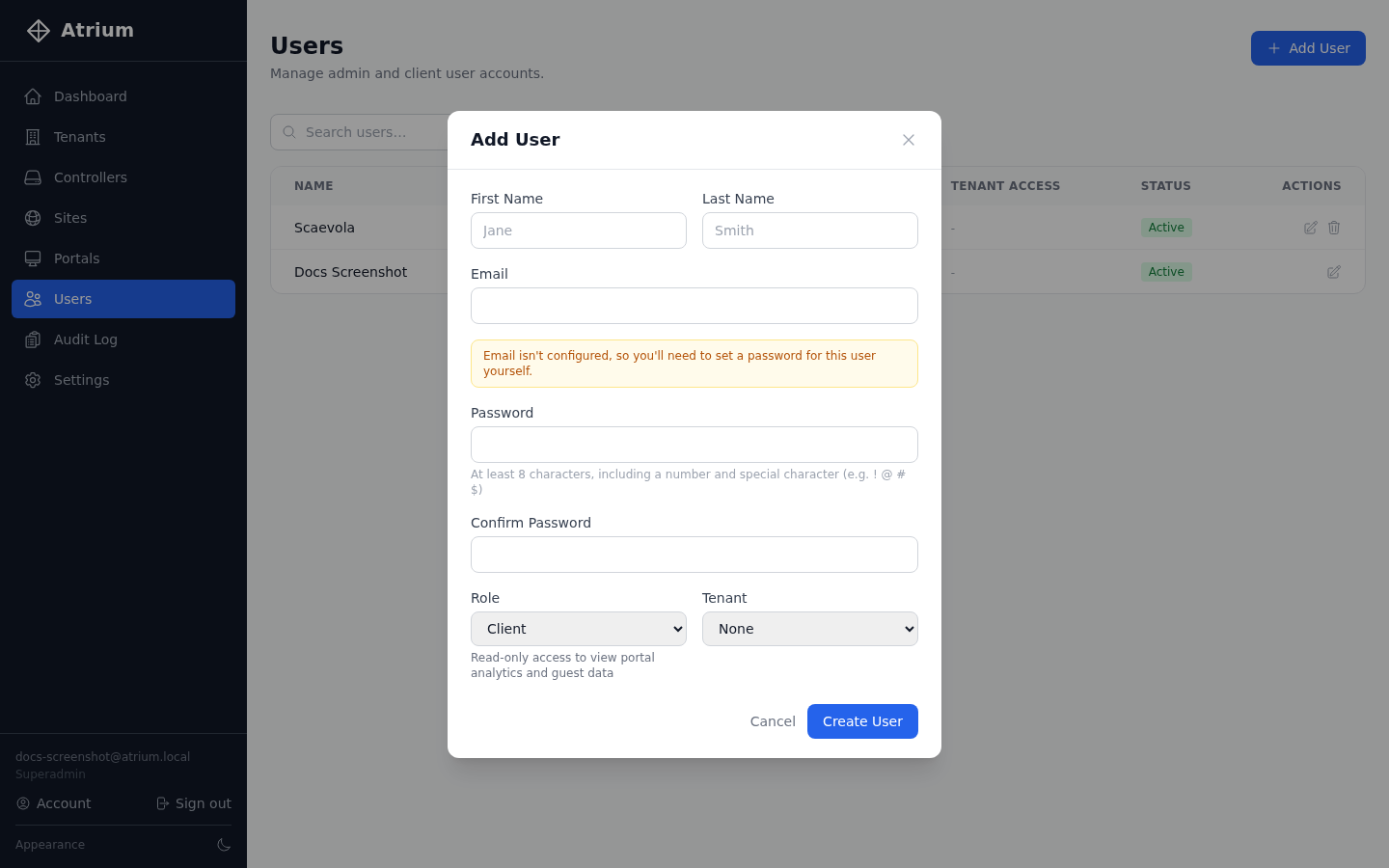 Add User dialog showing name, email, password, and a Role dropdown with a description of that role's access